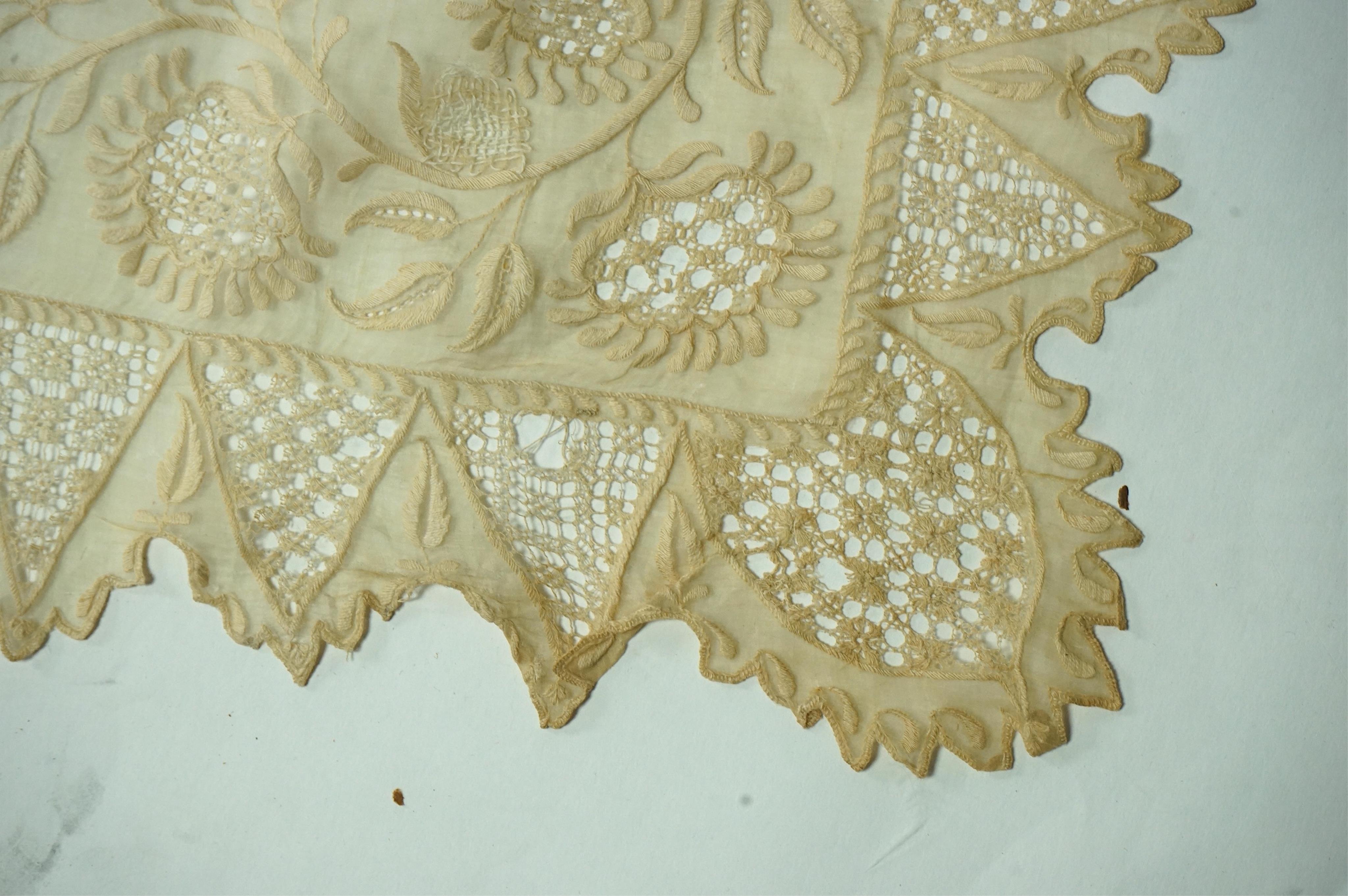 A 1920’s wax wedding headdress, a white feather fan, a bone brise and an earlier long lawn embroidered and lace worked stole., Stole 194cm long. Condition - headdress and fan good, stole has moth holes in places but can